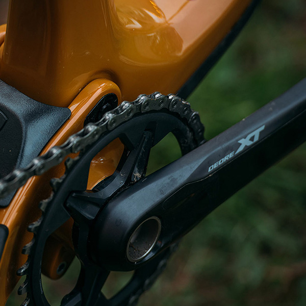 close up of a black bike crankset on an orange rocky mountain brand mountain bike