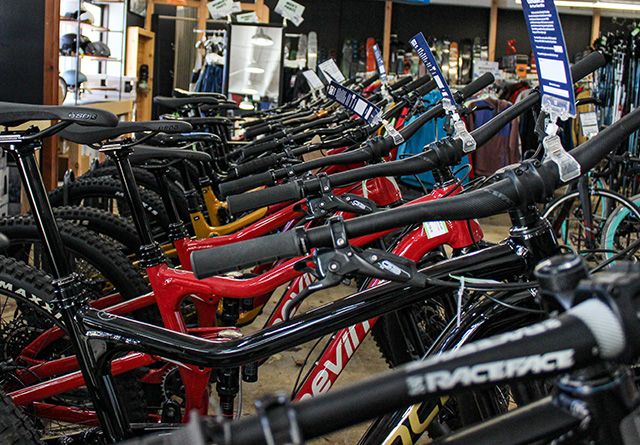 #row of bikes lined up in a level nine retail store