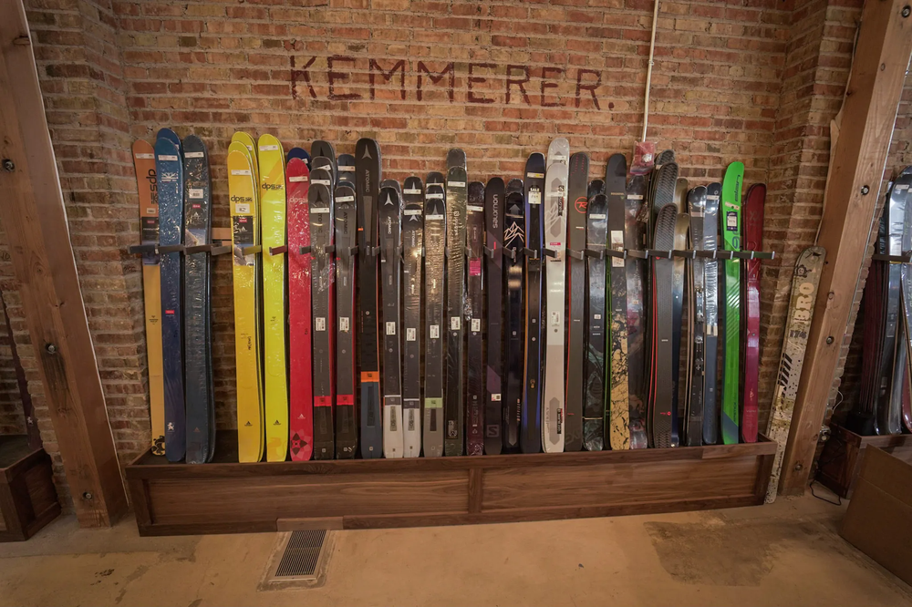 Skis leaning against a wall displayed for retail customers
