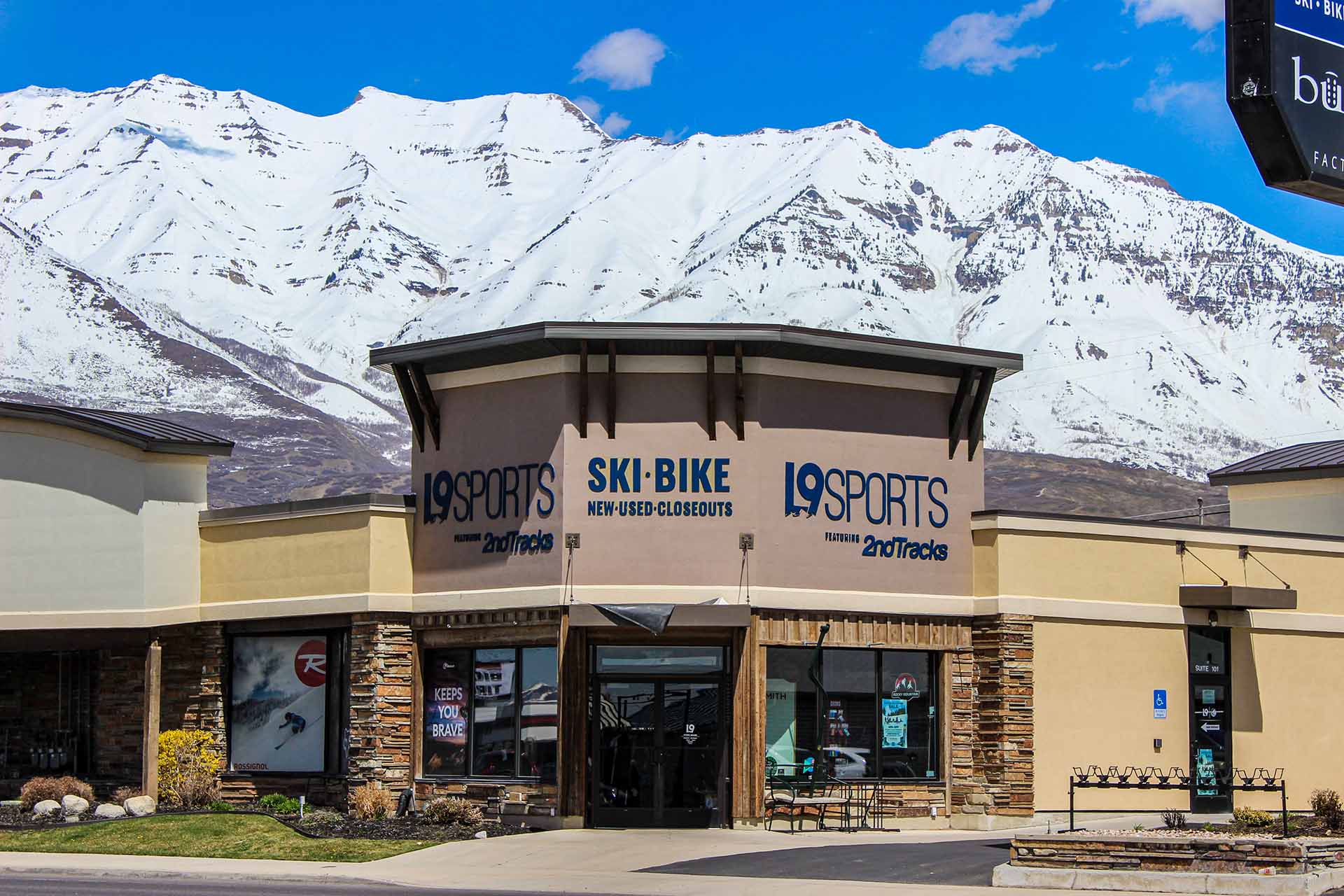 Exterior of Level Nine Sports in Orem with a mountain range behind the store.